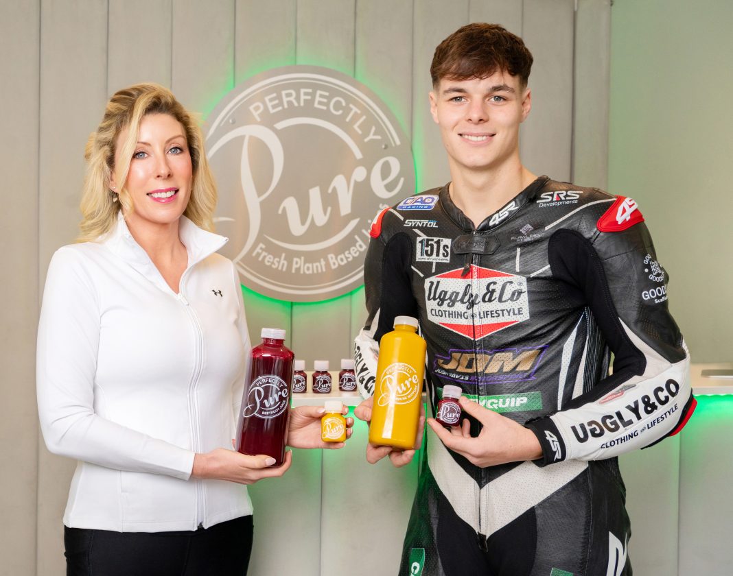 Kathie McCausland, founder of Perfectly Pure Juices with racing star Adam Brown from Dungannon with her signature Immune Support juice and fast selling Beetroot Juice